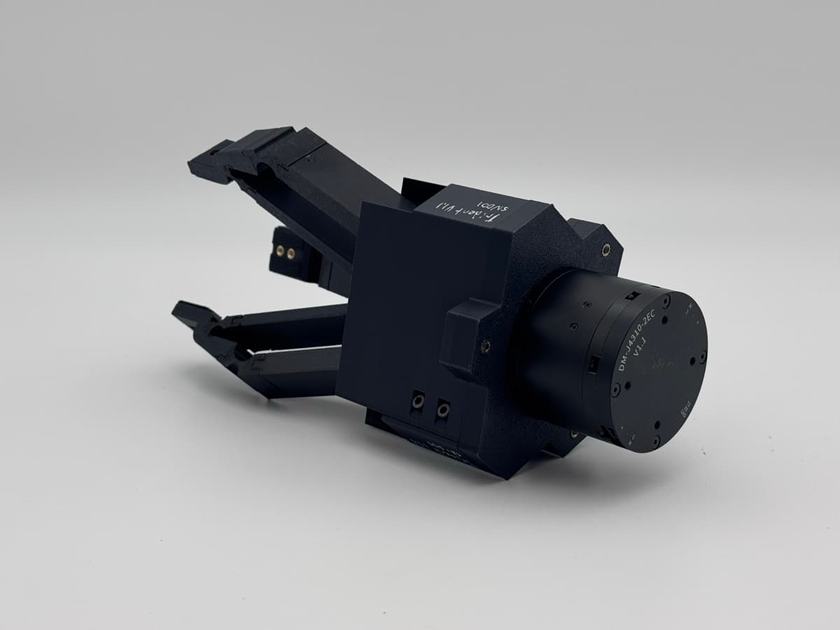 Nibbler v1.1 three-jaw gripper mounted on an OpenArm platform.